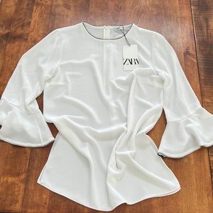 White ruffled sleeve blouse